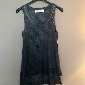Netted tank top with a high low hem and silver studs around arm hole